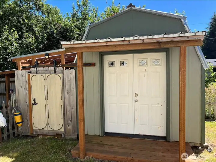 Note the porch cover for the storage shed.