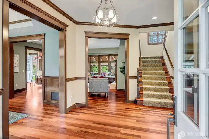 Elegant entry with gleaming hardwood.