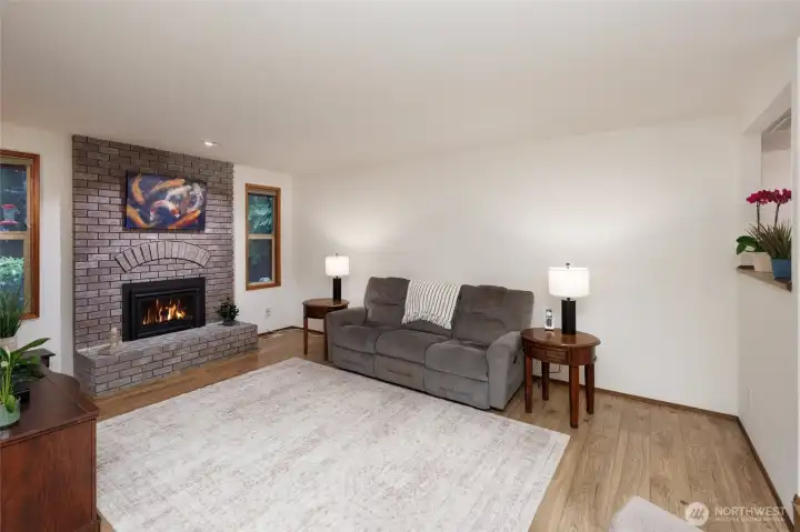 Great room concept w/floor to ceiling brick gas fireplace