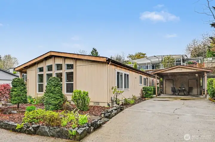 … featuring a covered carport and spacious driveway