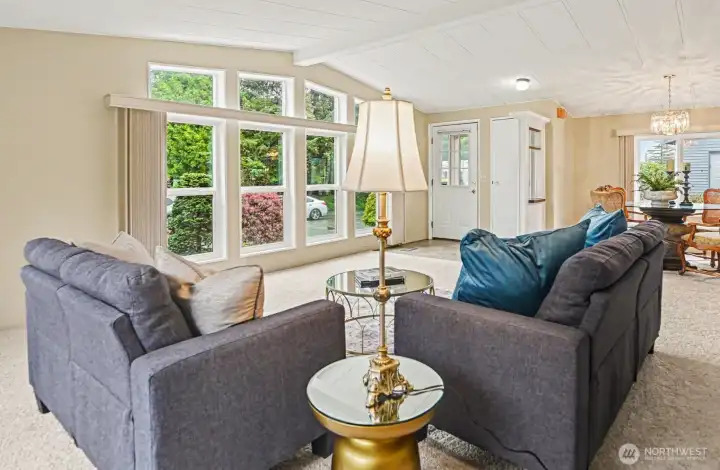 Bright, open-concept living and dining space with abundant natural light…