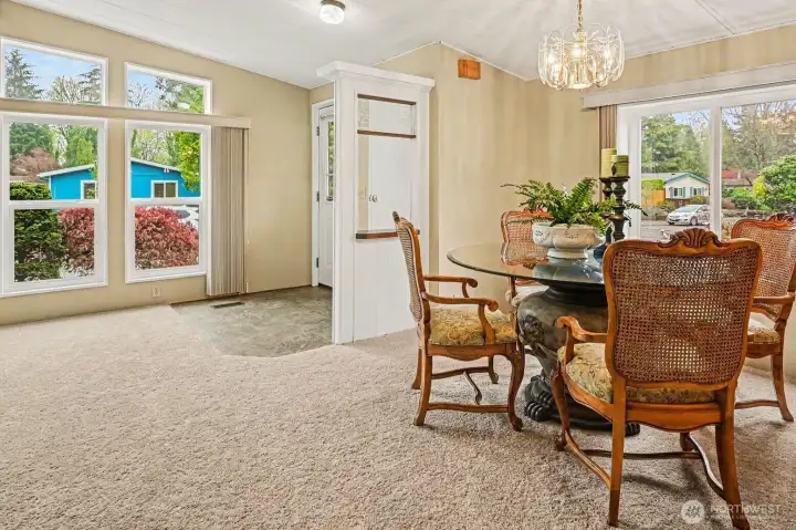 Dining area featuring large windows, and seamless flow—perfect for entertaining.