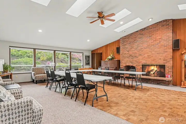 This community space features a warm and inviting atmosphere, perfect for social gatherings and activities