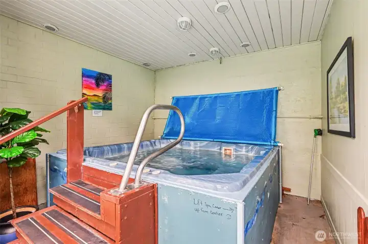 Melt away the day's stress in the private indoor hot tub, a serene corner designed for ultimate relaxation