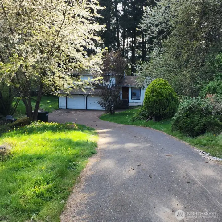 Long driveway, private setting, home sits back off street