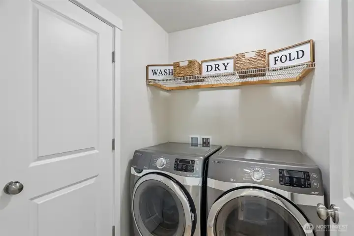 Laundry room with access to owners closet