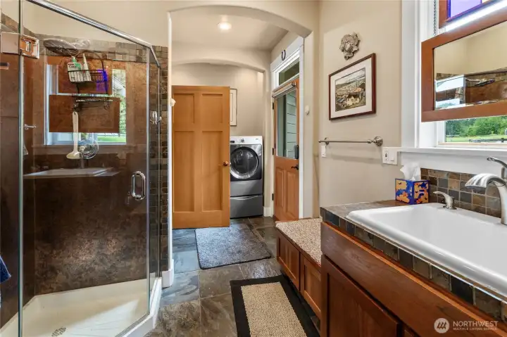 Utility Room complete w/  washer & dryer that stay with home, walk-in shower and toilet and sink with separate entrance to home!