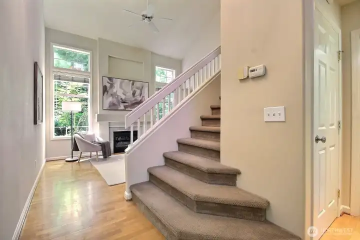 Soaring vaulted ceilings, dramatic windows, and a cozy gas fireplace welcome you and create a space you'll love coming home to. Soaring vaulted ceilings, dramatic windows, and a cozy gas fireplace welcome you and create a space you'll love coming home to.