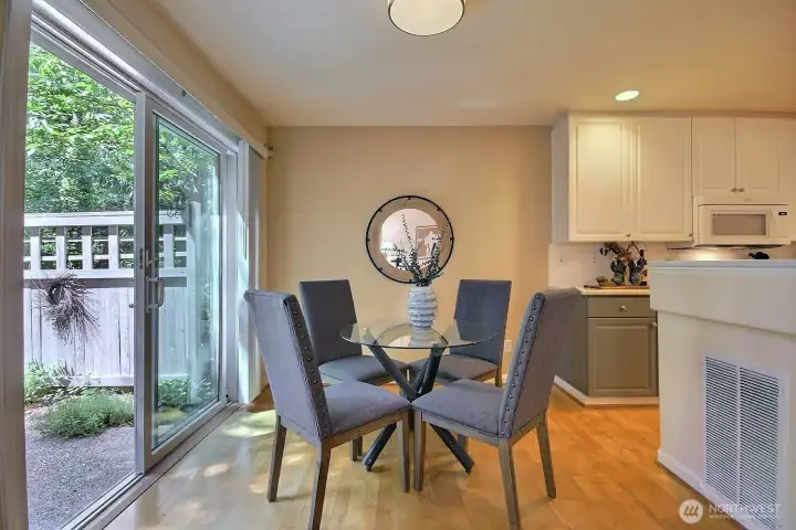 The dining area connects beautifully to both the kitchen and the private patio through a sliding door, perfect for easy entertaining and everyday convenience. The dining area connects beautifully to both the kitchen and the private patio through a sliding door, perfect for easy entertaining and everyday convenience.
