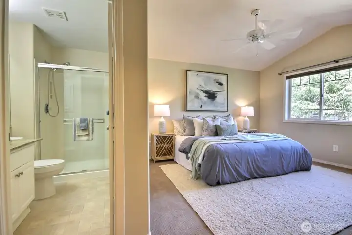 A unified view of the primary suite and private ensuite bath showcases a spacious layout with a relaxing, spa-like feel. A unified view of the primary suite and private ensuite bath showcases a spacious layout with a relaxing, spa-like feel.