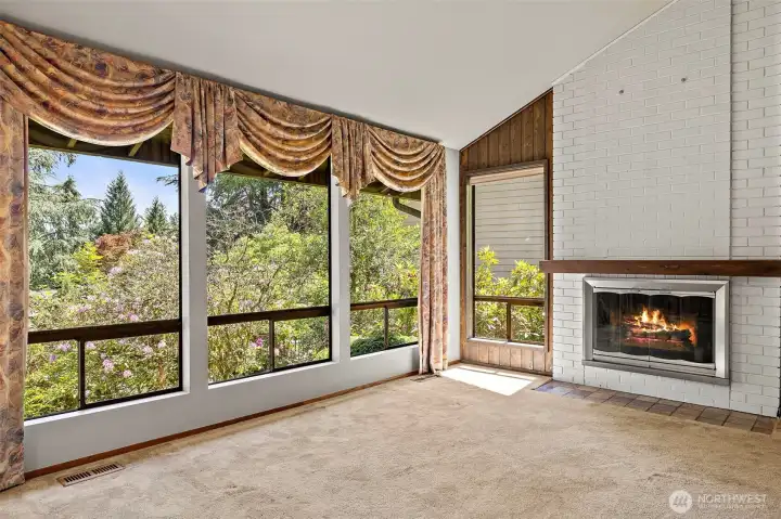 Living room with wood burning fireplace is big and open!   Lots of Light!