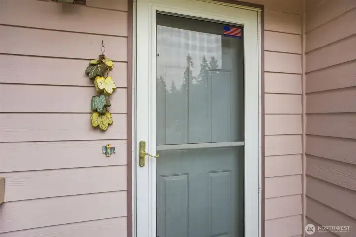 Front door with a nice storm door, plus a fresh coat of paint on the stairs and the landing redone. Front door with a nice storm door, plus a fresh coat of paint on the stairs and the landing redone.