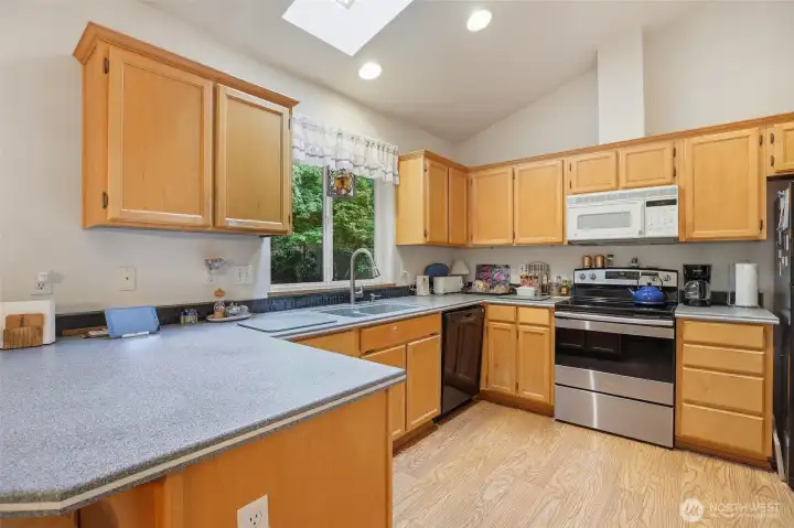 Kitchen features an abundance of cabinets and light. Kitchen features an abundance of cabinets and light.
