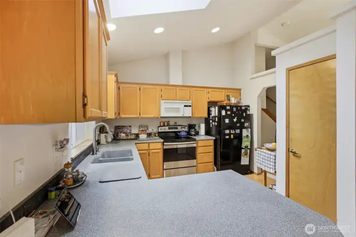 This kitchen features recessed lighting, enhancing the space in addition to the skylight thats strategically located. Closet door secretly hides the pantry. This kitchen features recessed lighting, enhancing the space in addition to the skylight thats strategically located. Closet door secretly hides the pantry.