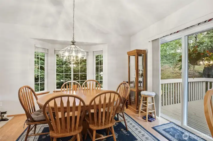Dining room flows seamlessly onto the rear deck, perfect for indoor-outdoor entertaining or private relaxation. Dining room flows seamlessly onto the rear deck, perfect for indoor-outdoor entertaining or private relaxation.