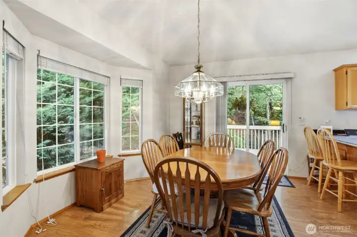 Bright and spacious dining room featuring an abundance of windows that allow for natural light and outdoor views. Bright and spacious dining room featuring an abundance of windows that allow for natural light and outdoor views.