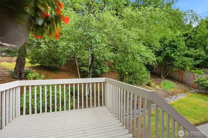 Rear deck overlooking the grounds. This residence boasts a secluded, largely fenced-in backyard framed by established trees. This impeccably kept outdoor area offers an ideal retreat for unwinding in a quiet, private setting. Rear deck overlooking the grounds. This residence boasts a secluded, largely fenced-in backyard framed by established trees. This impeccably kept outdoor area offers an ideal retreat for unwinding in a quiet, private setting.