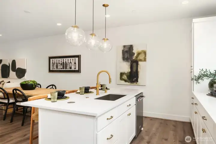 White painted cabinetry features pull out shelves. 3cm quartz slab countertops & Paloma tile backsplash. White painted cabinetry features pull out shelves. 3cm quartz slab countertops & Paloma tile backsplash.