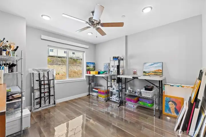 Second bedroom offers versatility of a bedroom, an office, or an art studio.