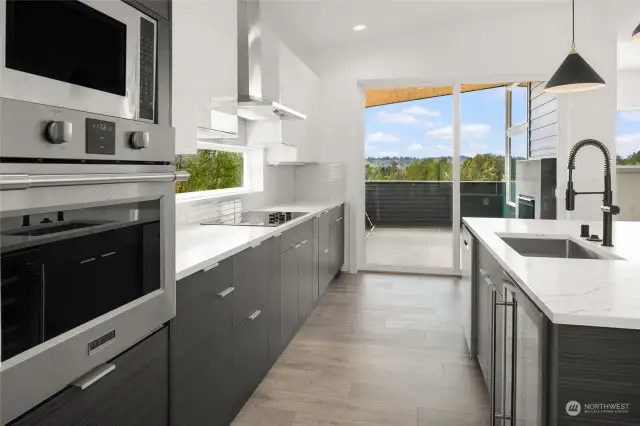 Convection Stainless Steel Oven • Convection Microwave • Full Height Tile Backsplash • Large Sliding Door provides access to covered front & rear patios, both equipped with gas fireplaces.