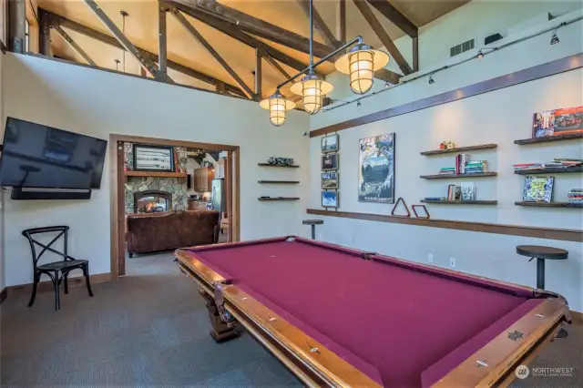 The pool room and media center at The Lodge serve as an ideal secondary living space, offering both relaxation and entertainment options.