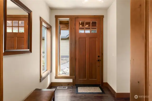 You're greeted by a warm front entry as you step through the gorgeous wood door.