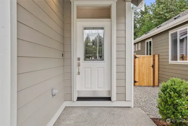 Covered front porch. Photo for illustration only of same plan on a different lot, not actual.