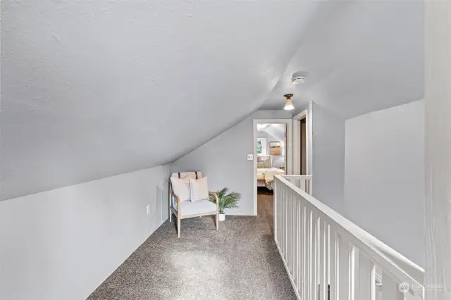 Upstairs hallway with multiple spaces for additional storage.