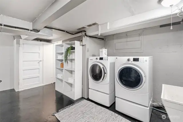 Utility room with an abundance of storage and access to the attached garage.