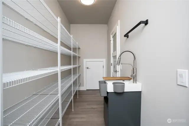 This pantry might just be big enough for all of the things we buy. A small prep sink makes this a great space to get ready for fun