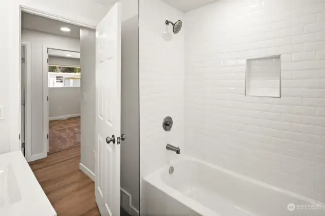 Main Bath completely renovated with brand new shower, bathtub tile & custom alcove.