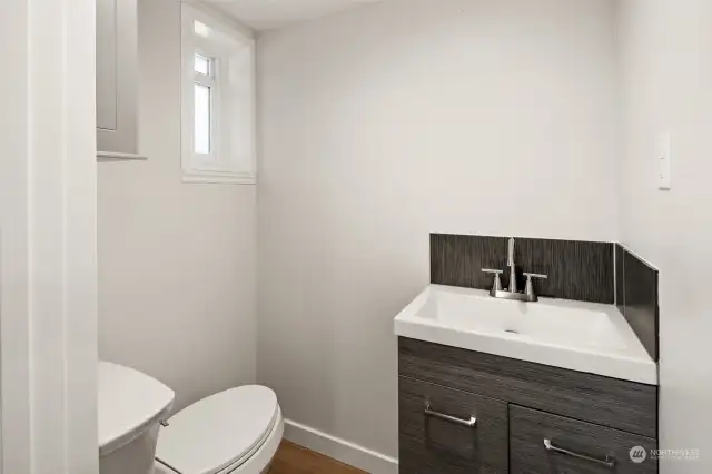 Half Bath with upgraded vanity, sink & faucet and new toilet