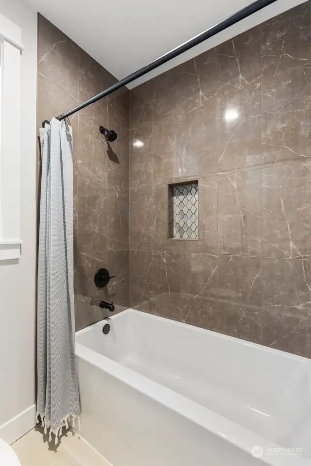 Full Tub and Tile Surround in upper guest bathroom