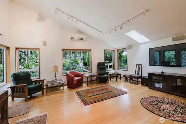 Framed by expansive windows, the great room is bathed in the natural beauty of the outdoors. You'll feel enveloped by nature in your own home!