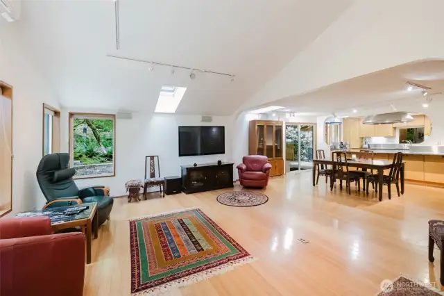 From this angle, the seamless flow between the sun-drenched great room and functional kitchen highlights the home’s open space.