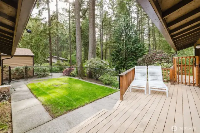 This gated front yard features a spacious front deck - enjoy the tranquility of your surroundings in style!