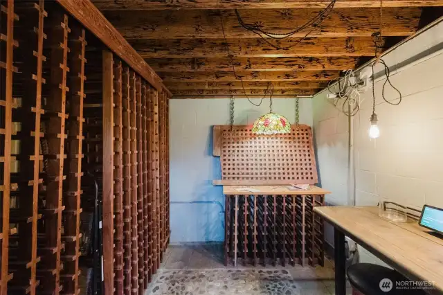 Rows of carefully arranged wine shelves create an organized yet rustic ambiance, offering a perfect place to store and showcase your collection in a truly unique & intimate setting.