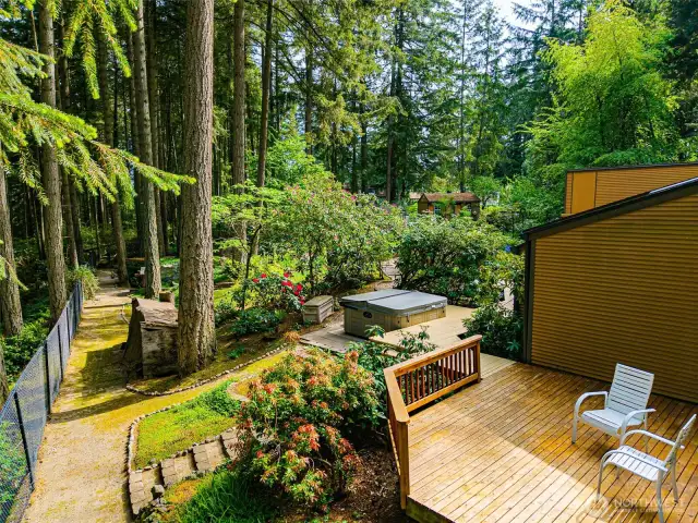 Catch some rays on the side deck, followed by a dip in the bubbling hot tub, all while basking in the natural sunlight.