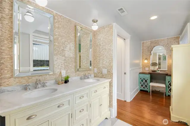 Primary Bathroom has windows for natural light, a tiled walk-in shower, Double Sink and a completely seperate vanity area area.