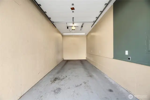Enormous Garage is extremely tall and deep. It is power and plenty of space for storage.  Just across from your front door and next to the Swimming Pool, everything is conveniently located.