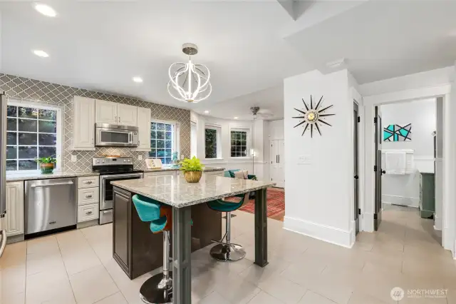 Kitchen Island is equipped with storage & seating.