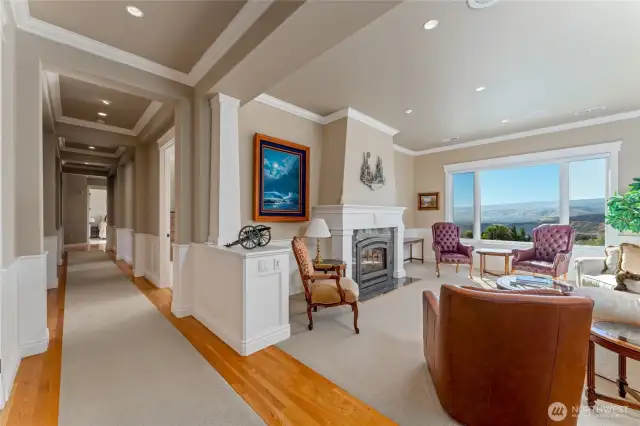 Welcome into the formal sitting room with gas fireplace