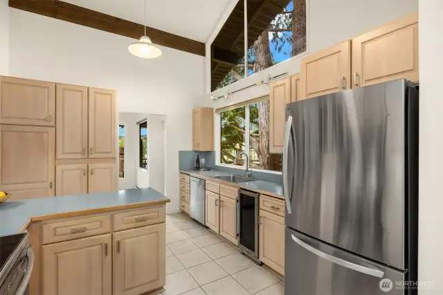 Such a cheery space! lots of natural light. Notice the wine fridge- got rid of the old trash compactor which no one ever uses and put in this in its place.