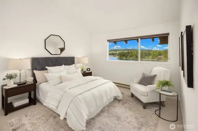 Primary suite is light and bright with water views! New carpeting in all carpeted areas.