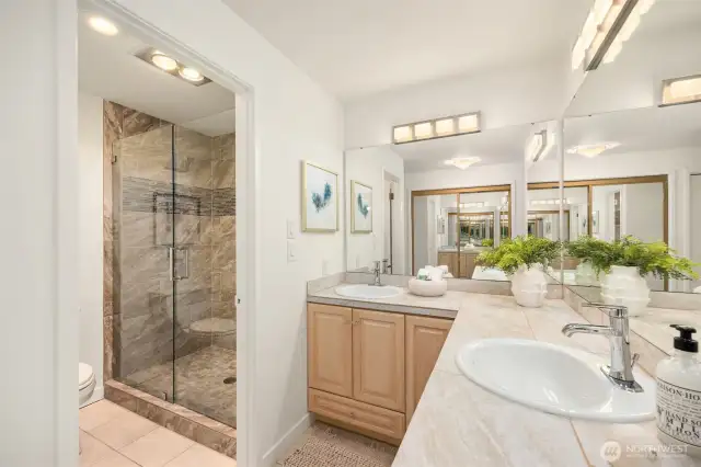 Gorgeous updated shower with beautiful heavy duty glass door.