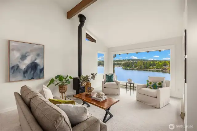 The tall ceilings and large windows really steal the show in here and along with the wood burning fireplace add a real architectural interest.