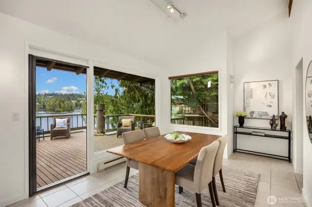 This beautiful dining room space is surrounded by windows and is located conveniently off the kitchen and living rooms.