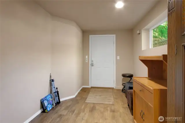 The room leading outside. Could be a small bedroom, mud room or?
