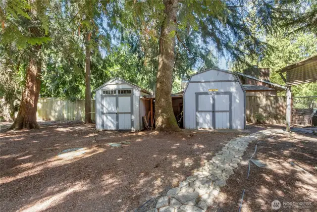 Two out buildings to the right of the property