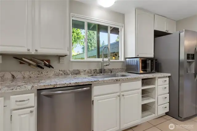 Closer view of the kitchen and pull outs to the right.